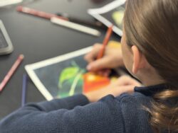 Teacher assisting student